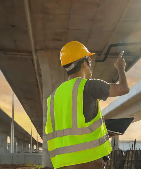 SHM Engineer Inspecting a Bridge