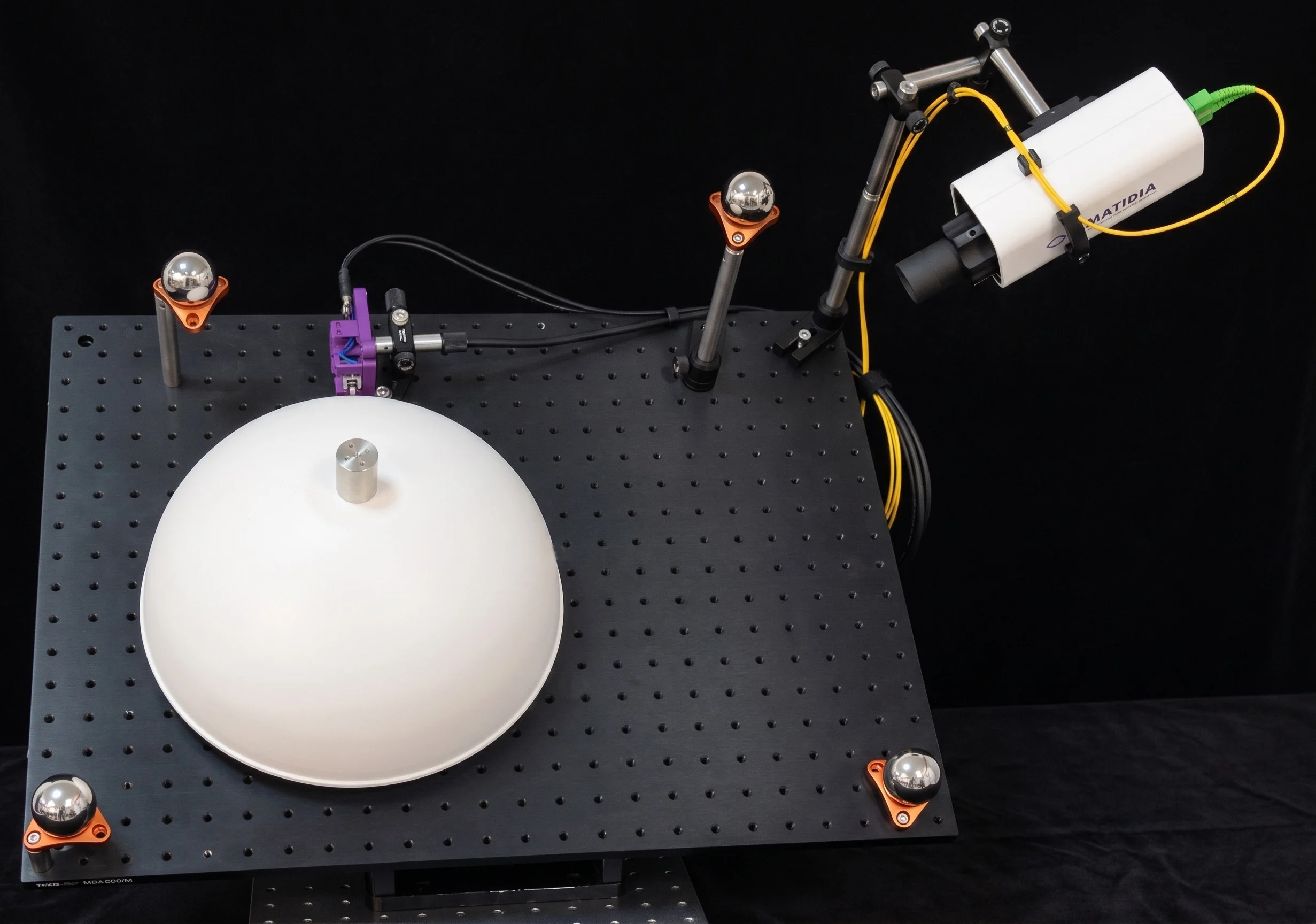 Ommatidia Q2 Laser RADAR measuring a hemispherical test object on an optical table.